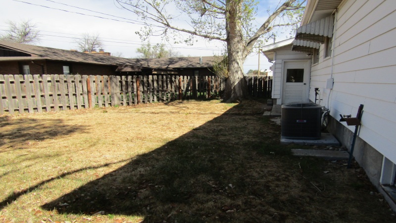 BACKYARD W DOOR TO GARAGE
