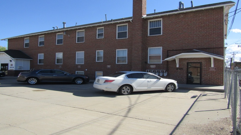 North side of building from parking lot showing each level of the building