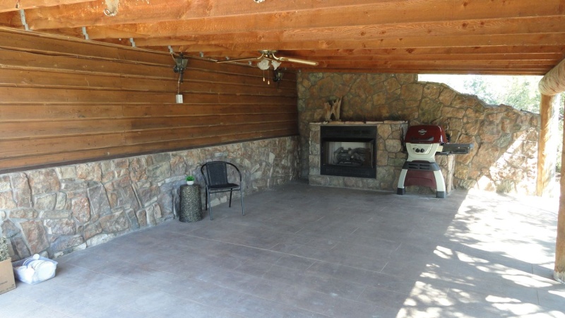 Attached covered patio w propane  fireplace 