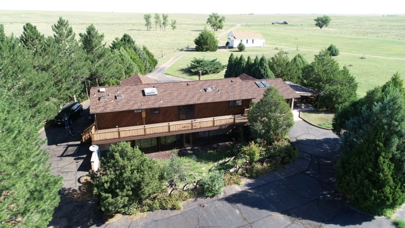 Aerial view of back of house/higway 34 in background