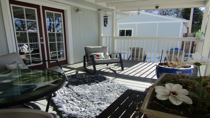 Covered deck/garage in background