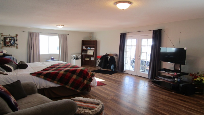 French doors from family room opens to cute deck
